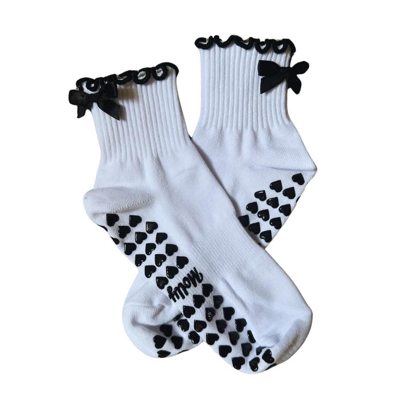 Black and white grip sock with bow and heart grips for pilates, barre, yoga or lagree