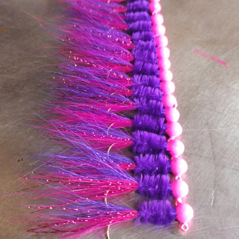 #9 pink head purple ostrich herl body with two tone bucktail and flash