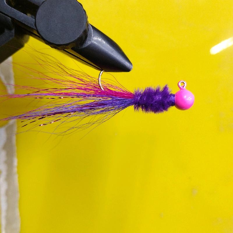 #9 pink head purple ostrich herl body with two tone bucktail and flash